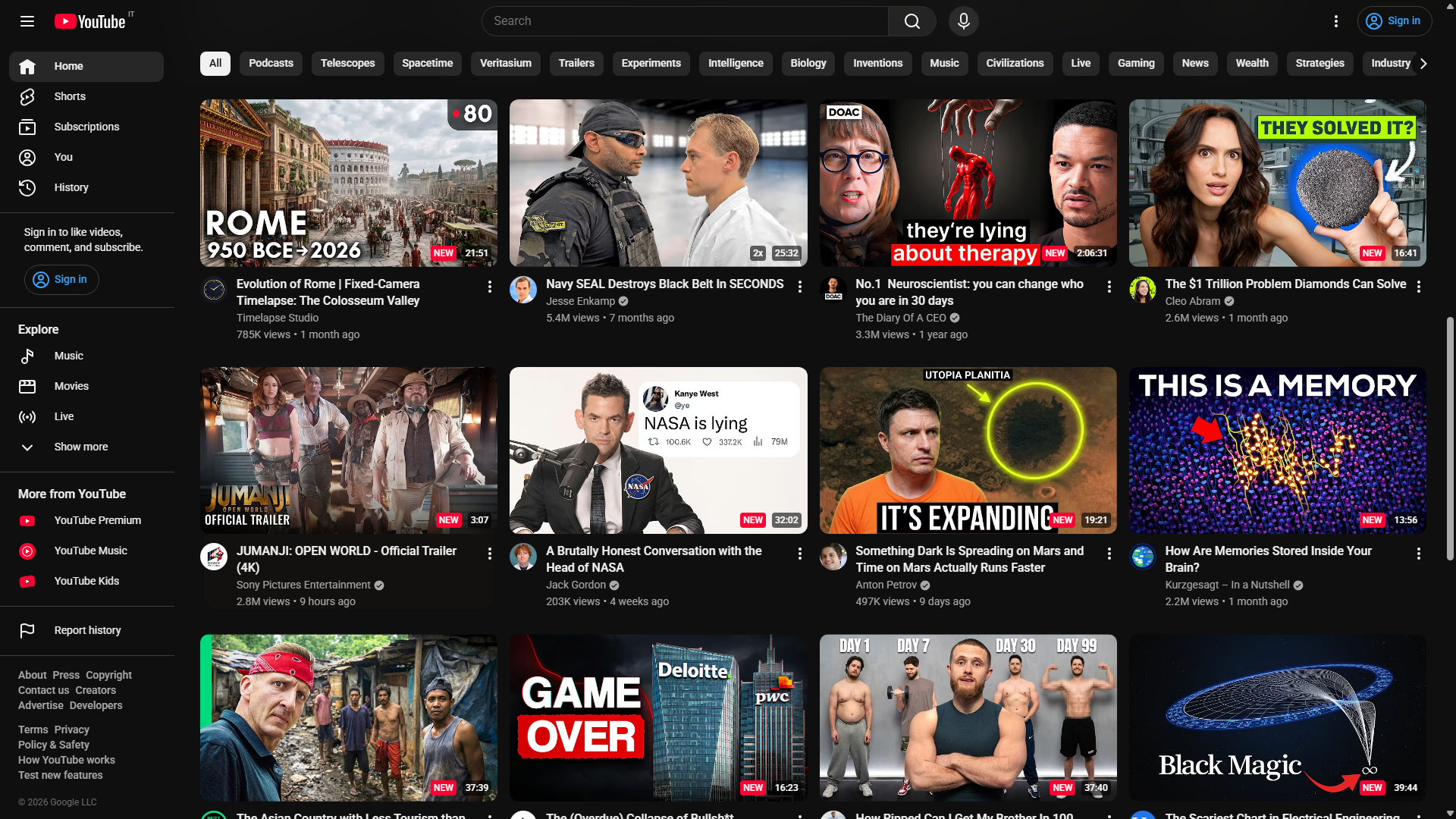 YouTube's homepage with a four-column grid and Paco badges marking new and repeated videos